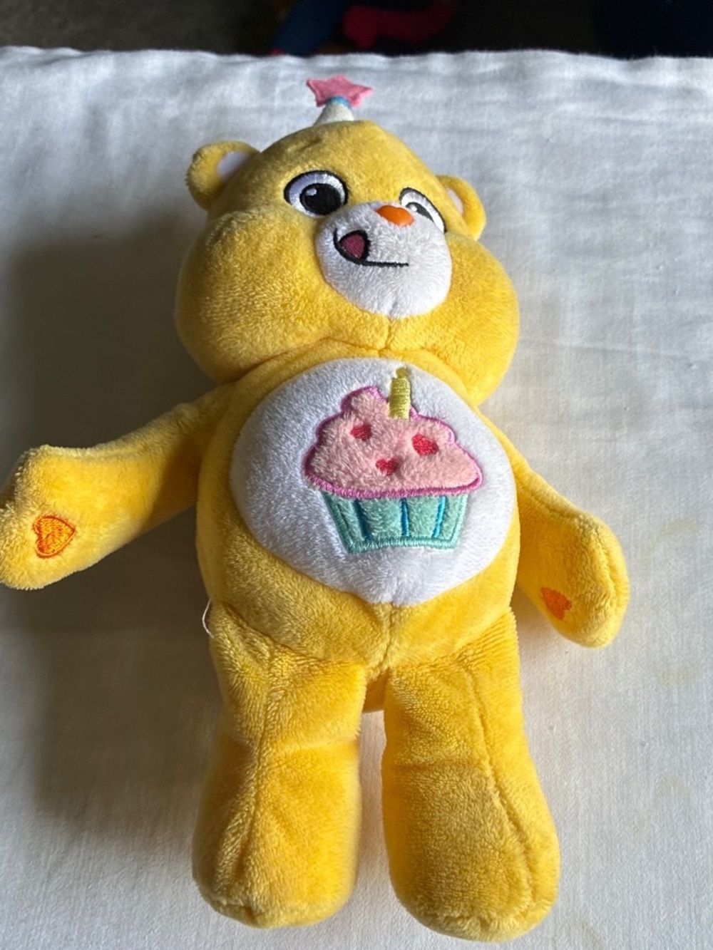 Care Bears Yellow Cupcake Care Bear Plush - Pink & Teal Embroidered Belly